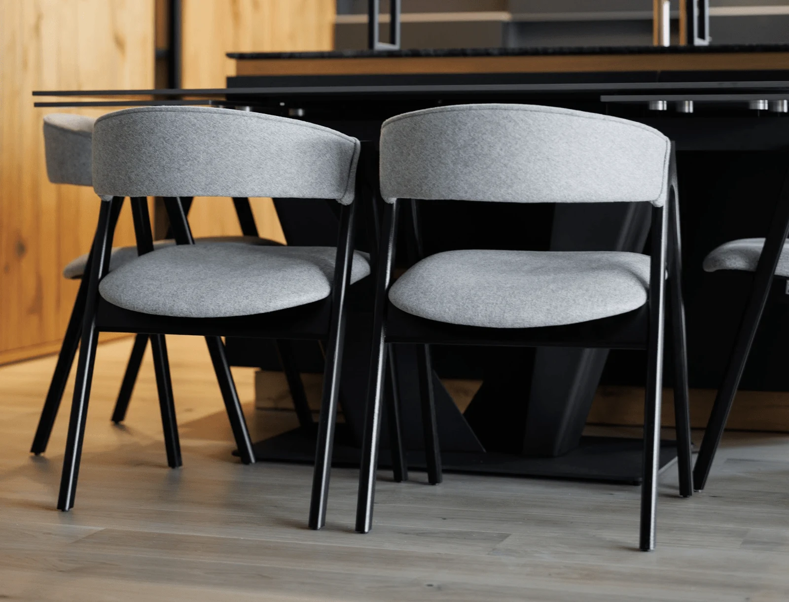 Grey Soho 902 weave Lain chair on a black-stained ash frame in a dark kitchen setting