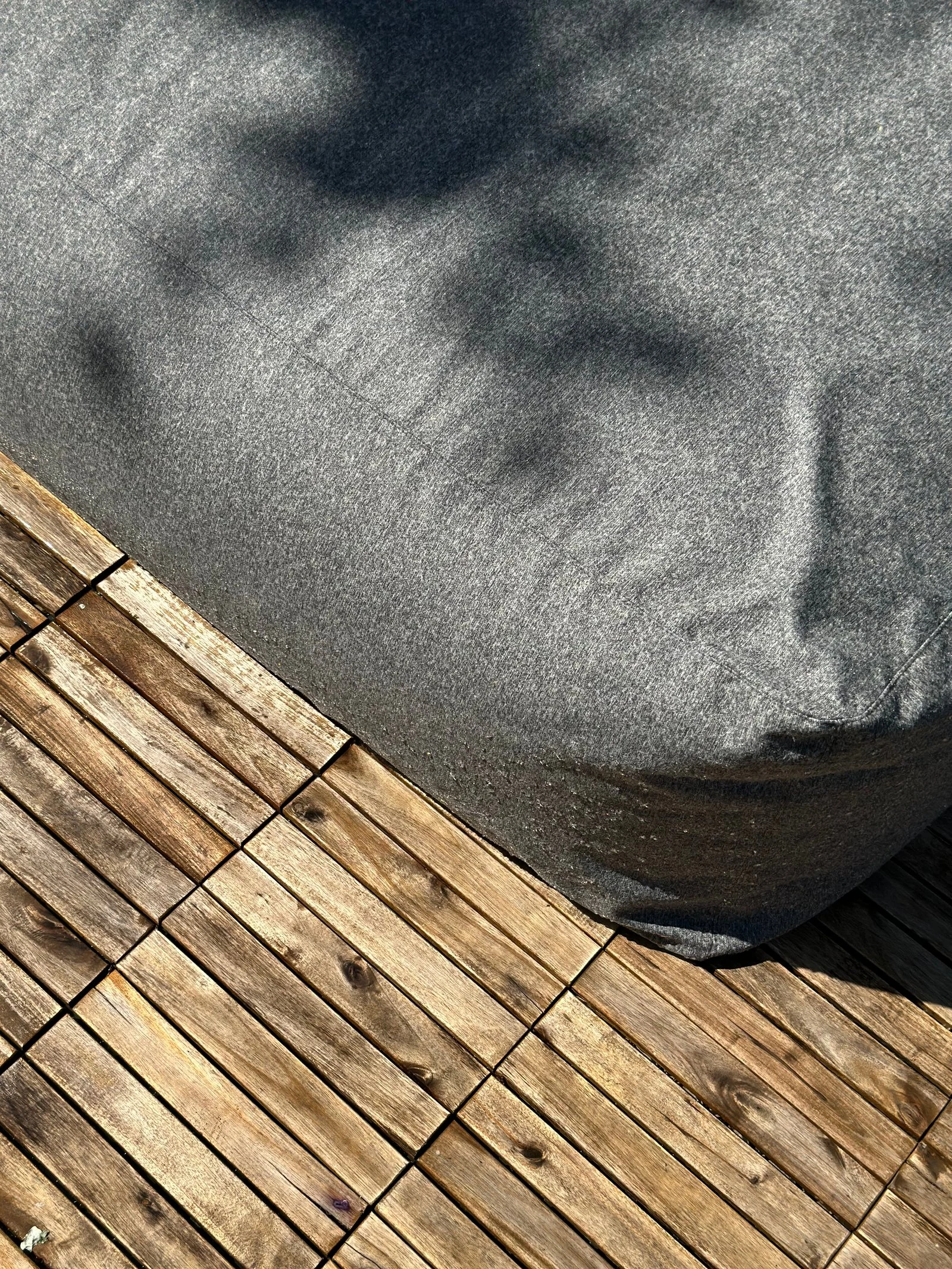 Marolla lounger with model resting on it, garden context