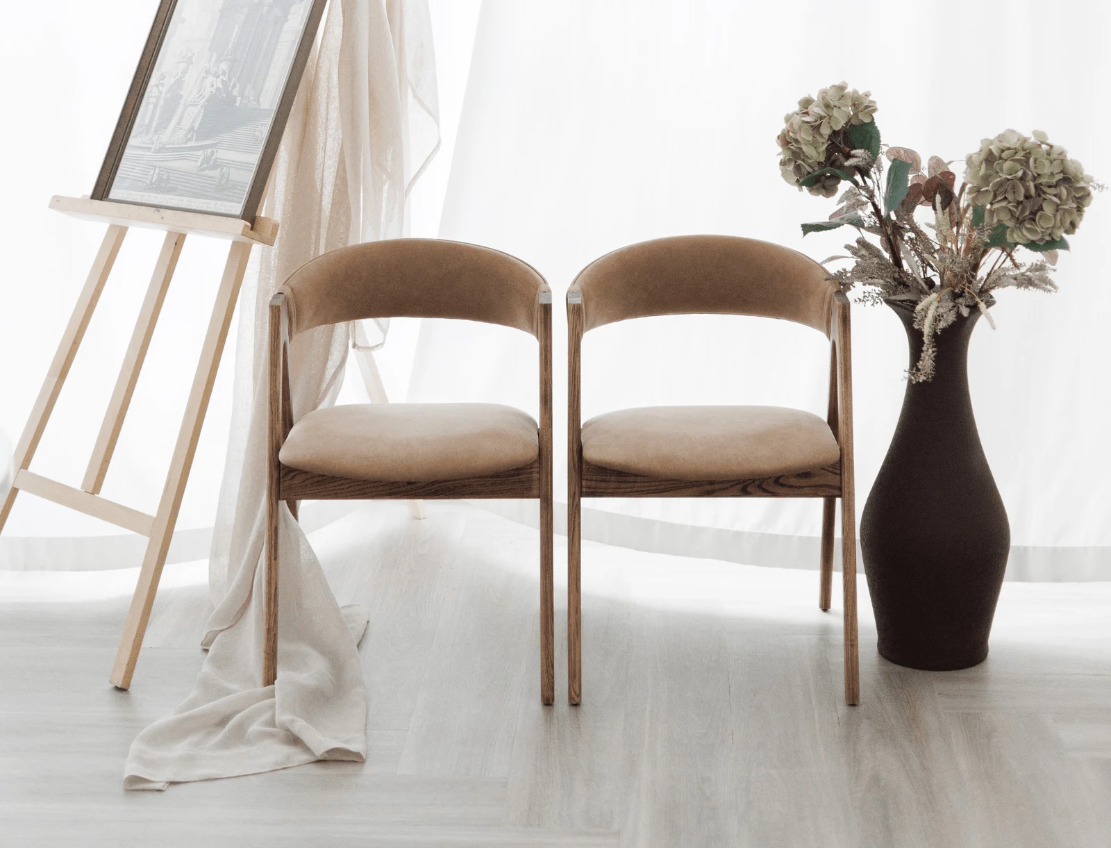 Lain chair upholstered in Como Light Brown Belgian leather on natural-ash frame