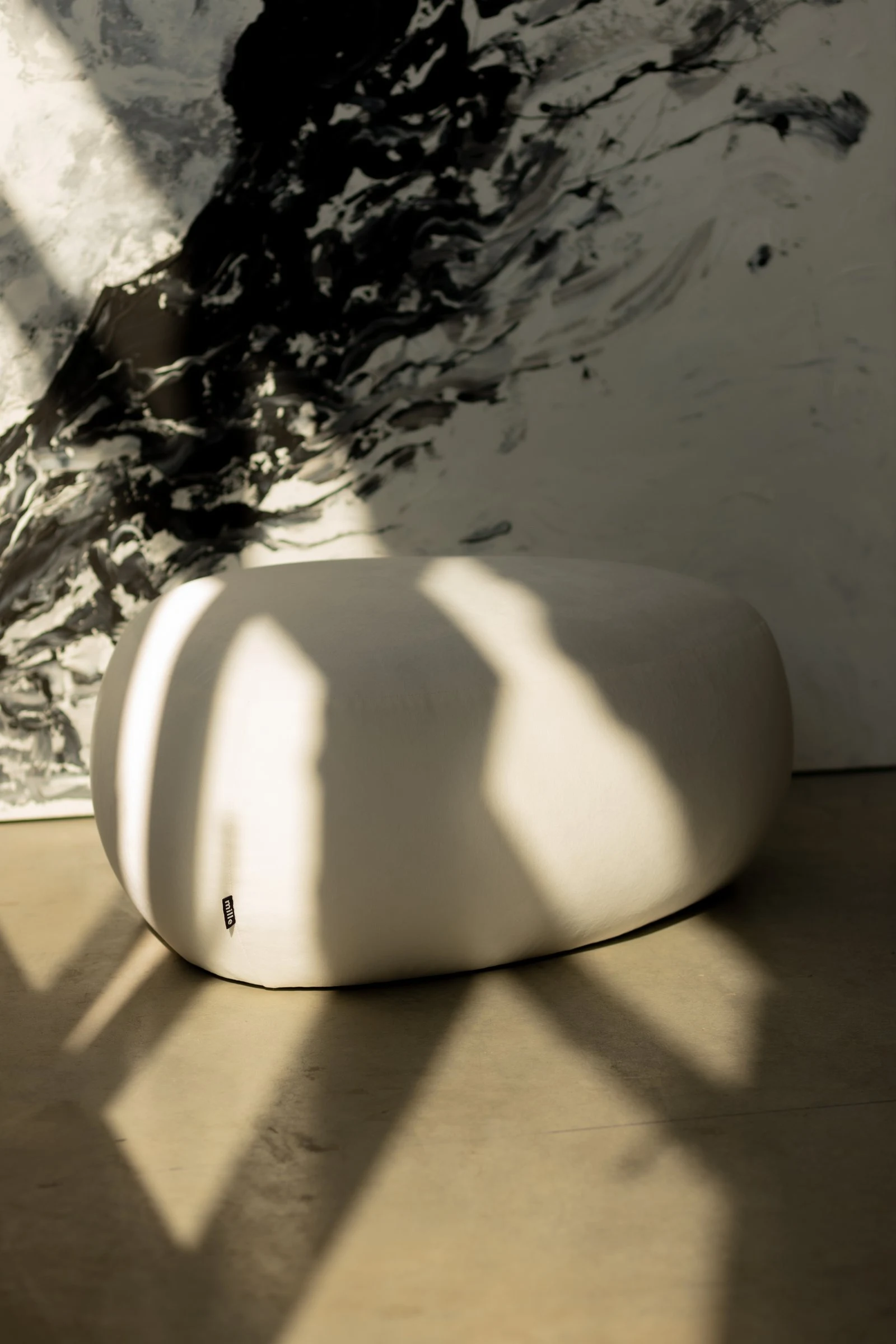 Chios pouf in natural Belgian weave fabric, studio