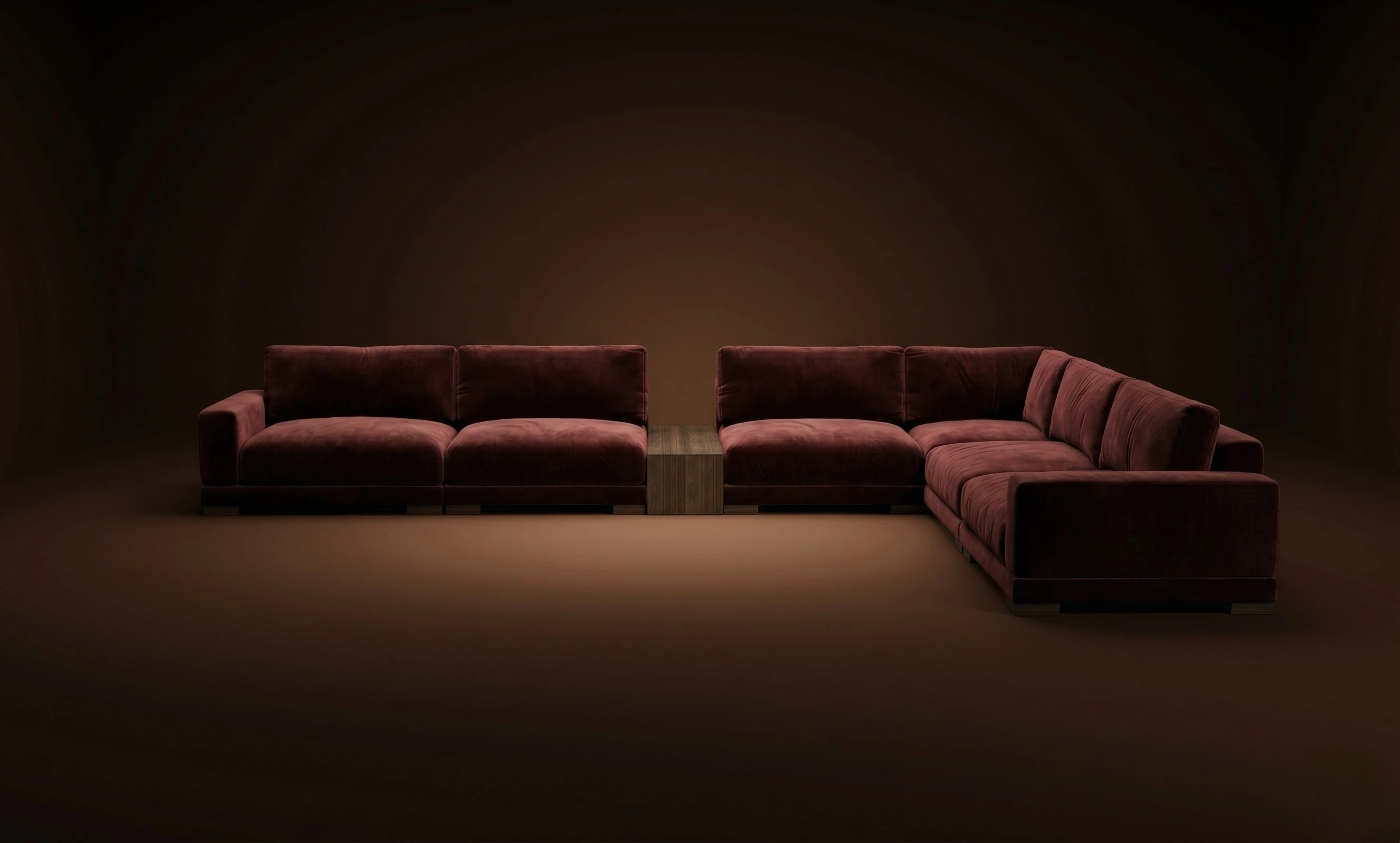 A burgundy Mille L with a corner island, in a dark studio
