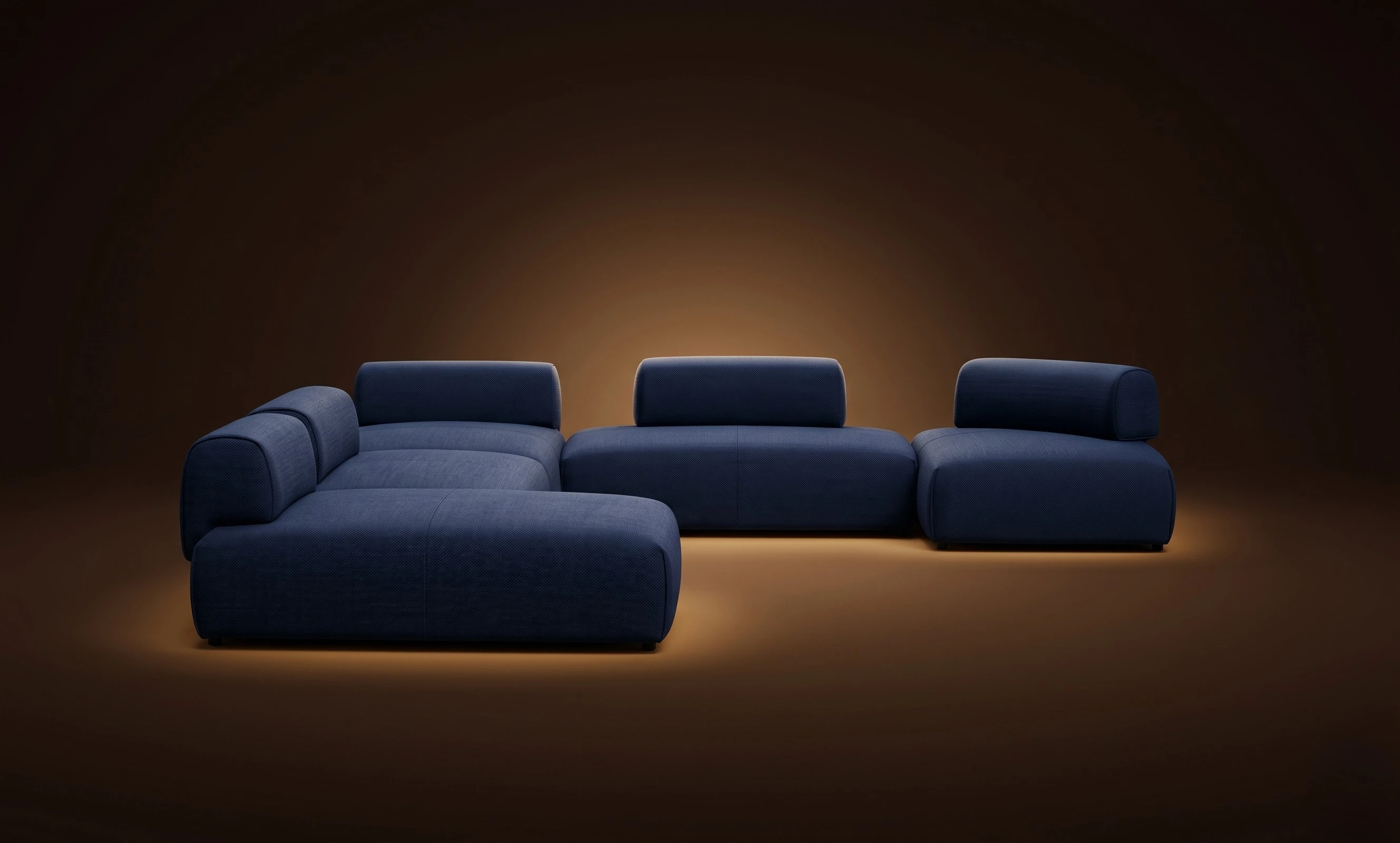 A navy Mille pair with island back-modules, in a dark studio