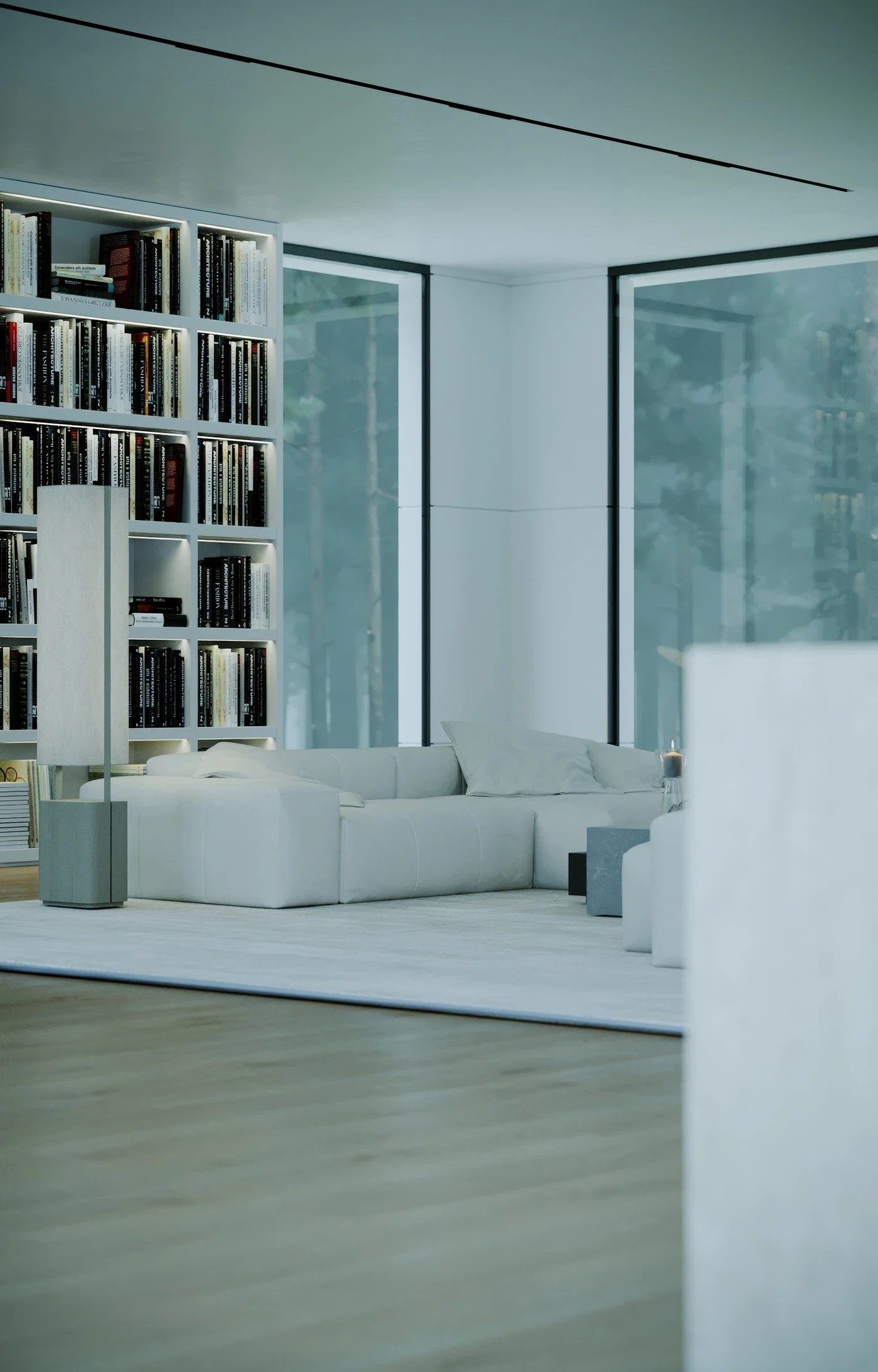 Cream Nami inside a modern home beside a tall wall of books and floor-to-ceiling windows