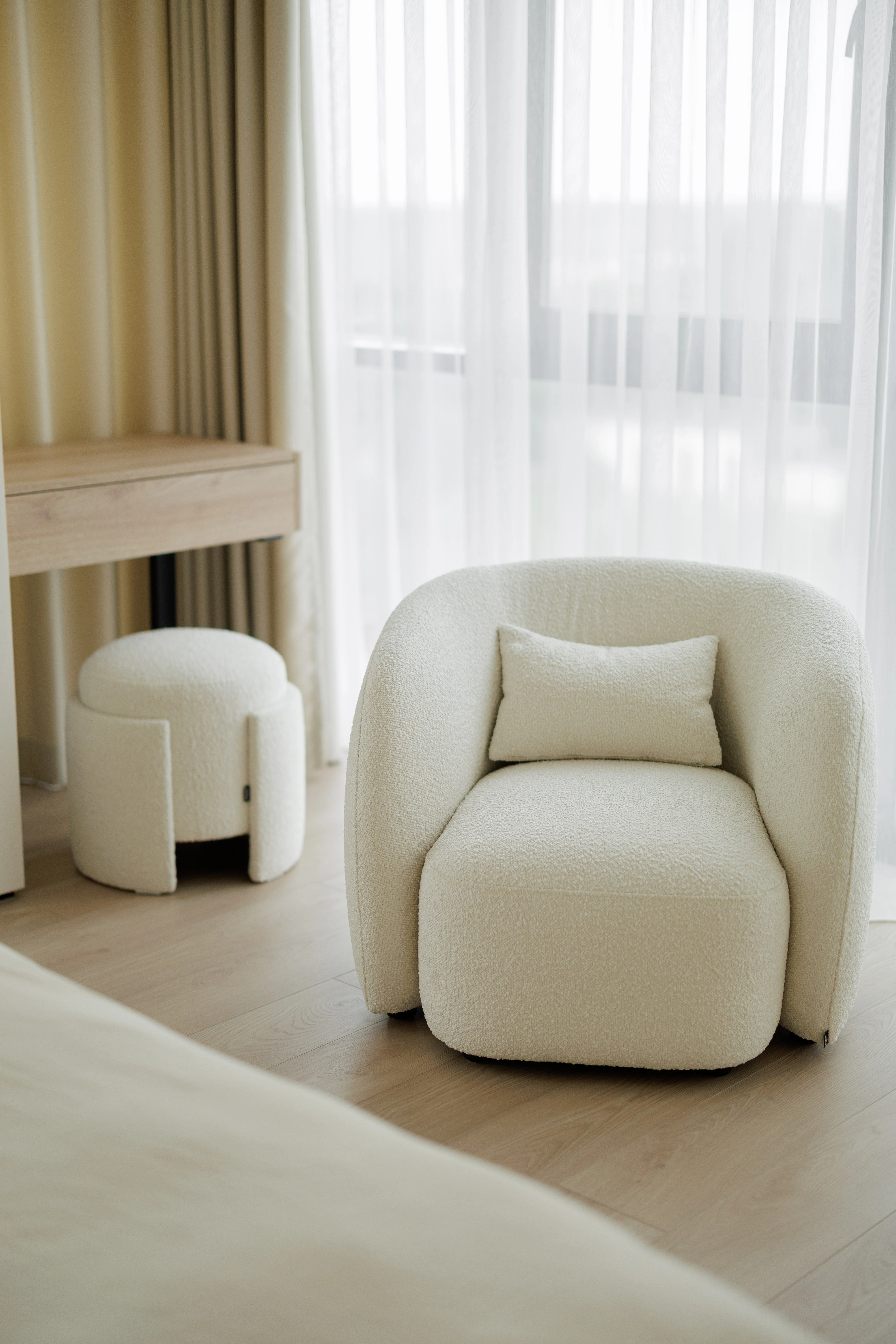 Close detail of the boucle texture on the Eden pouf