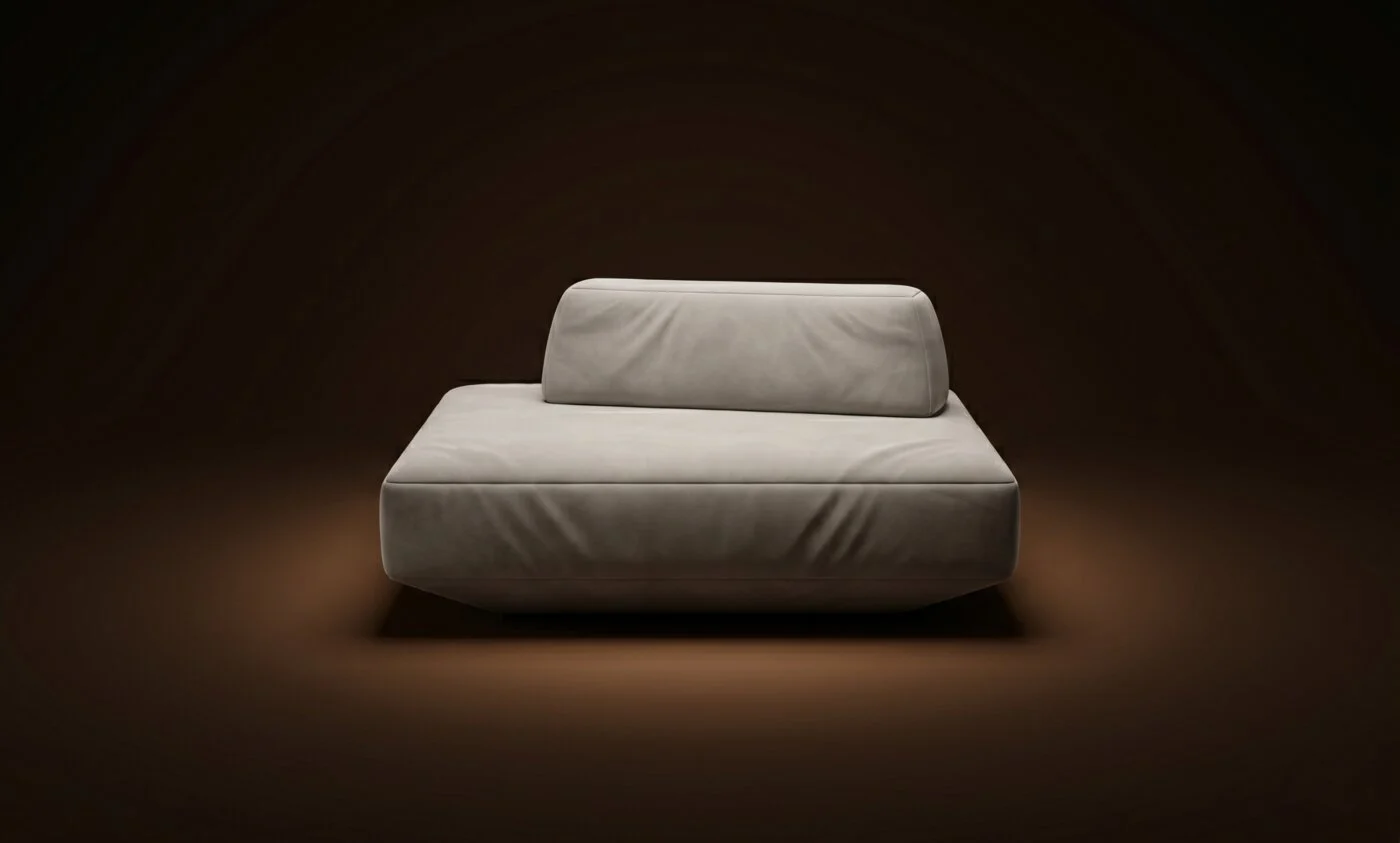 Cream Deseda solo module with a single bolster on a warm-dark spotlit stage