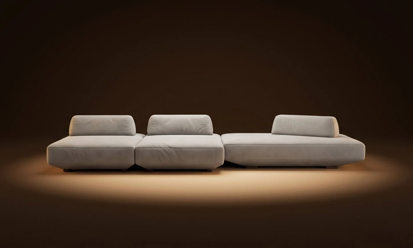 Cream Deseda three-module configuration with bolsters on a warm-dark spotlit stage