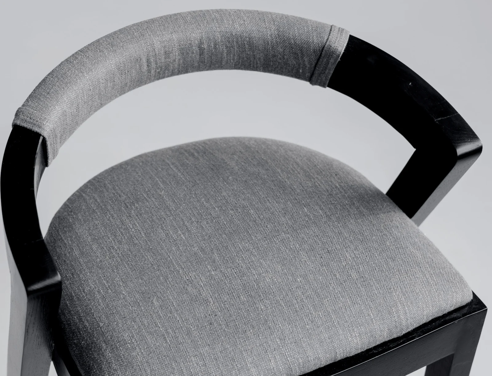 Close detail of the Baffi black-ash frame joinery under the seat