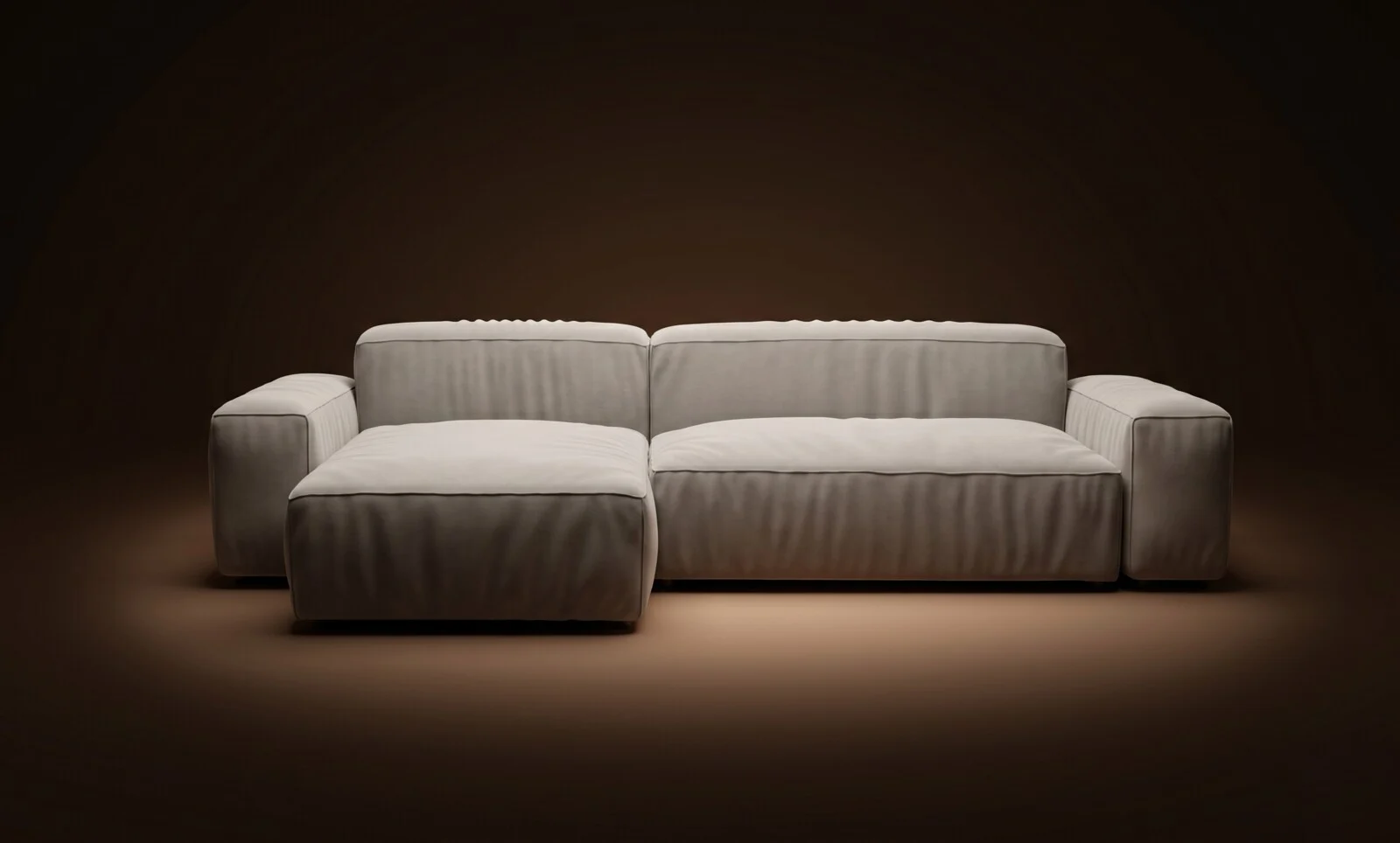 Cream Milano in an open L with floating chaise configuration on a dark spotlit stage