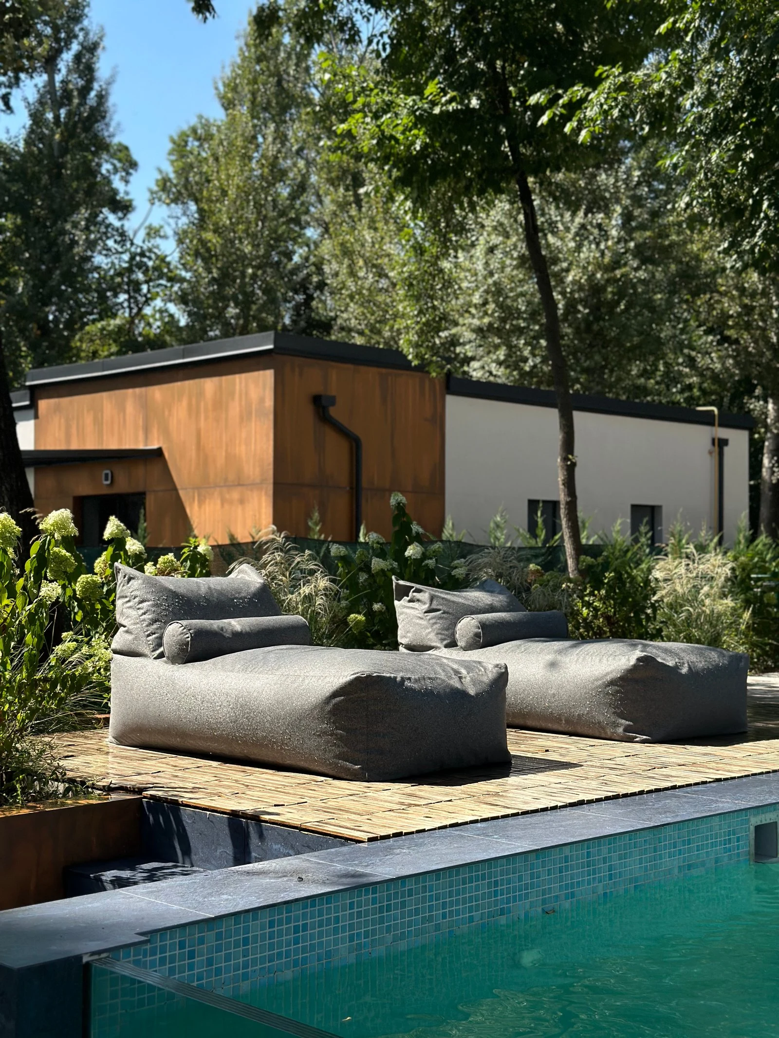 Side view of the Marolla lounger showing the soft bolster and floor-cushion form